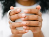 coffee mug in black hands