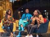 Three black women sat talking on stage at SANA fest 